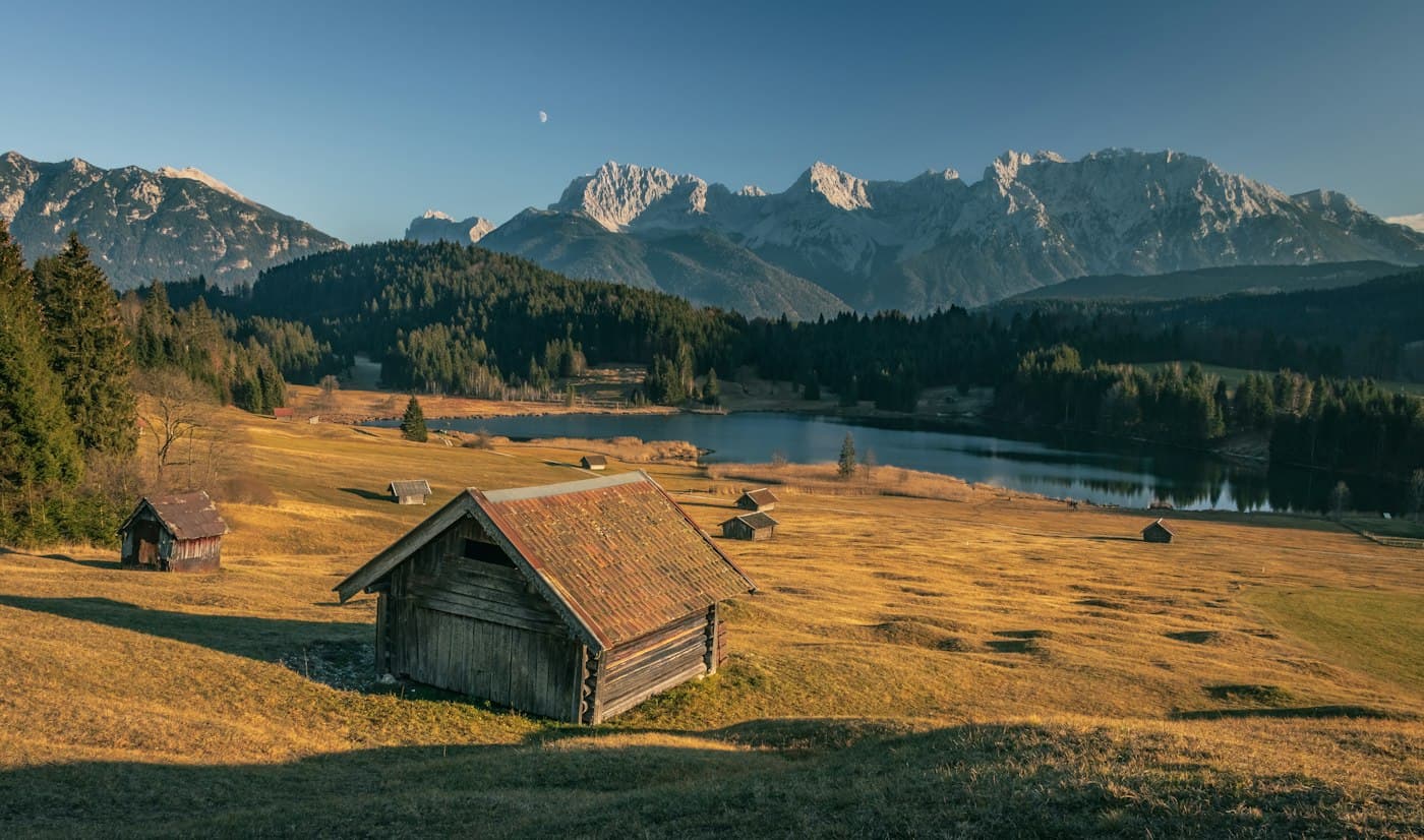 Wooden hay barn on an alpine meadow in Bavaria